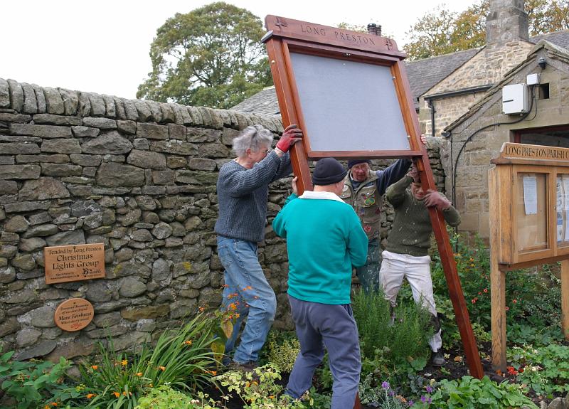 NB1.jpg - Members of the Heritage Group starting to install the new noticeboard.